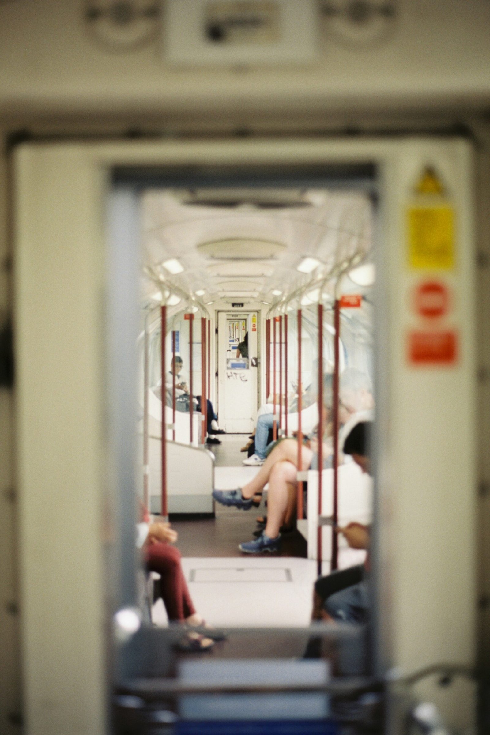 A group of people sitting on a train next to each other